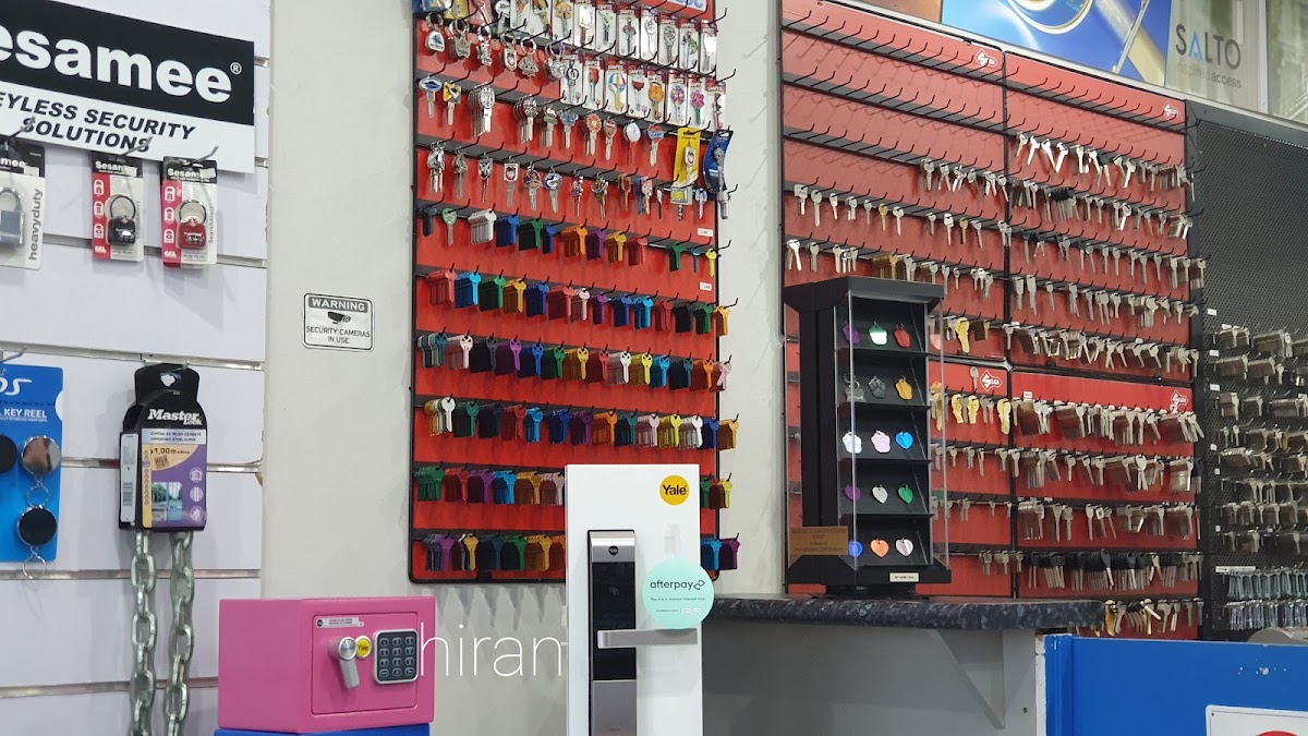 The Keytronics key wall at the Mt Wellington store — hundreds of cut blanks on red pegboard.